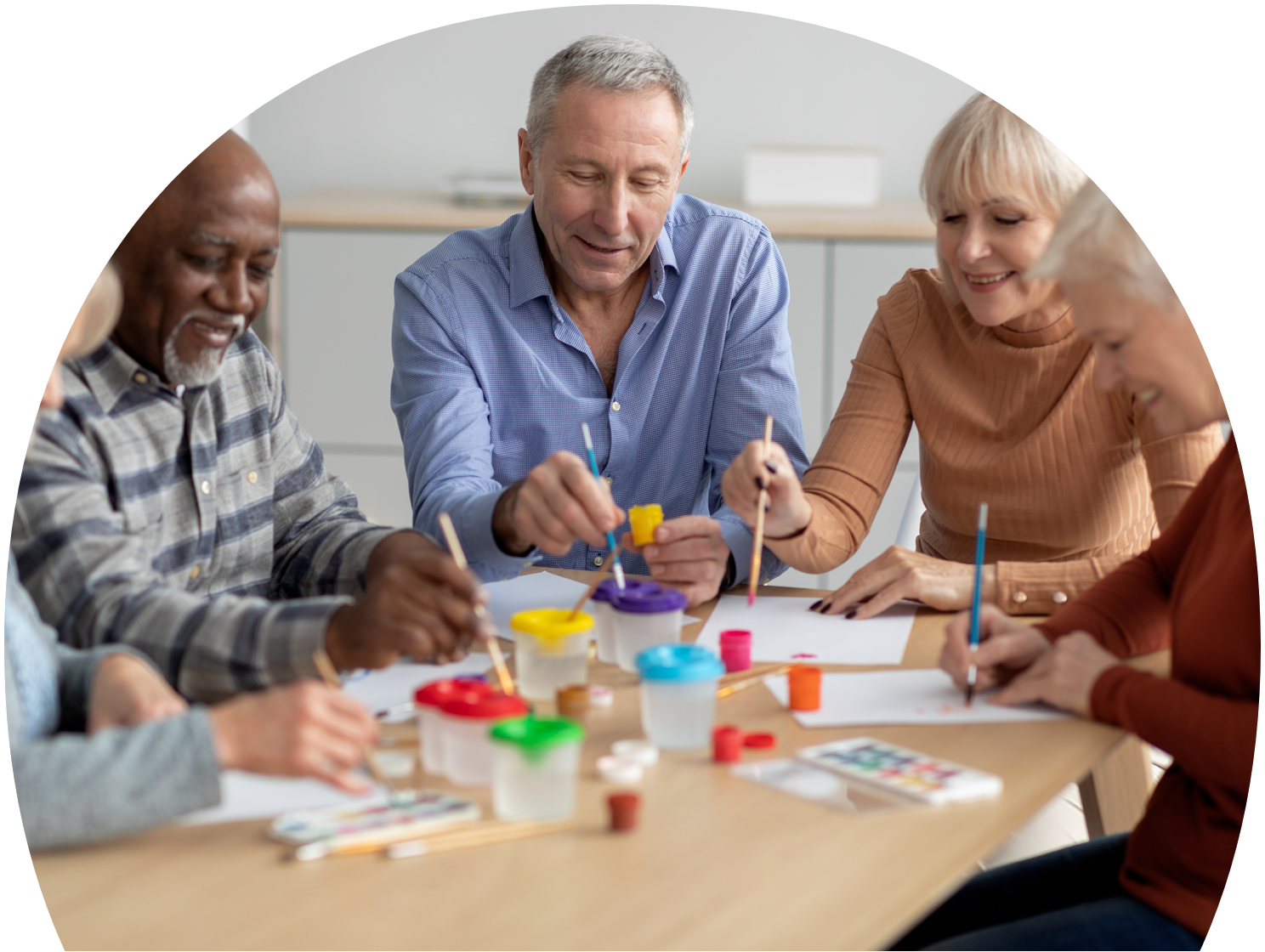 Retired Teachers engaging in a painting workshop.